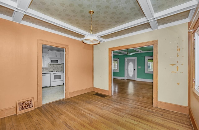 318 E Monroe St, Goshen, IN 46526 - unfurnished room with coffered ceiling, light wood-type flooring, ceiling fan, baseboards, and beamed ceiling
