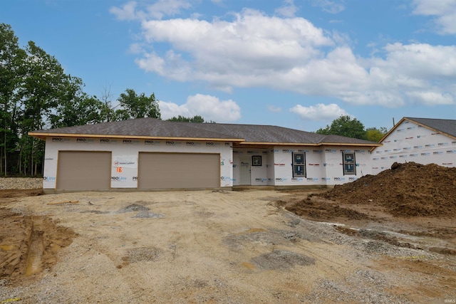 988 E Hawthorn Ln, Columbia City, IN 46725 - unfinished property with an attached garage and stucco siding