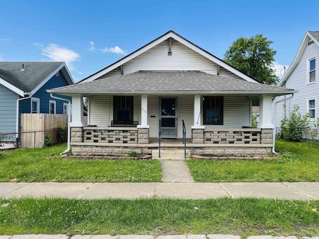 712 S 22nd St, Lafayette, IN 47905 - view of front of house with a shingled roof, covered porch, and stone siding