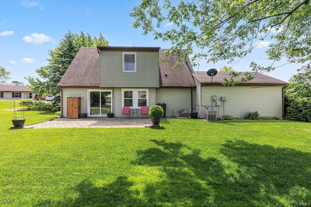 8809 Newberry Dr, Fort Wayne, IN 46825 - back of house featuring a yard, a patio, and central air condition unit