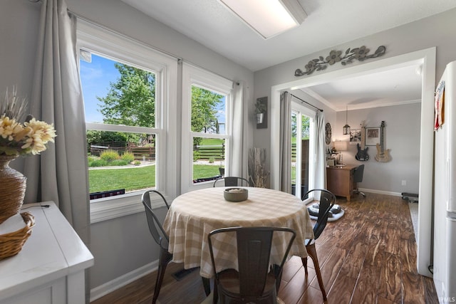 8809 Newberry Dr, Fort Wayne, IN 46825 - dining area with baseboards and dark wood-style flooring