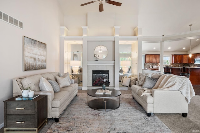 13849 Old Colony Dr, Granger, IN 46530 - living area featuring a ceiling fan, a fireplace, a high ceiling, and recessed lighting