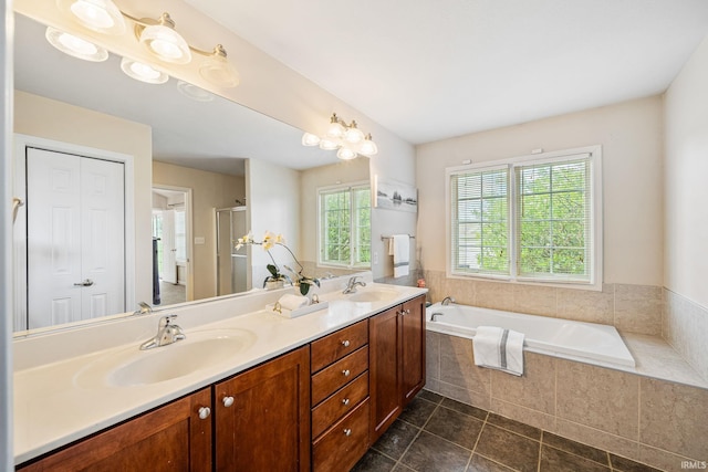 13849 Old Colony Dr, Granger, IN 46530 - bathroom featuring double vanity, a garden tub, tile patterned flooring, and an enclosed shower