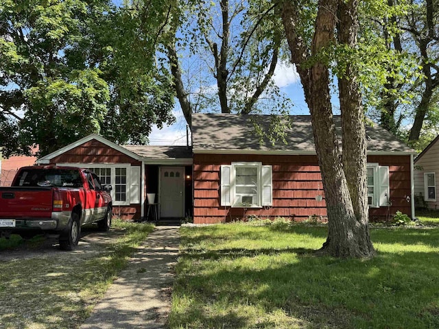 134 E Emerald St, Elkhart, IN 46514 - view of front facade featuring a front lawn and a shingled roof