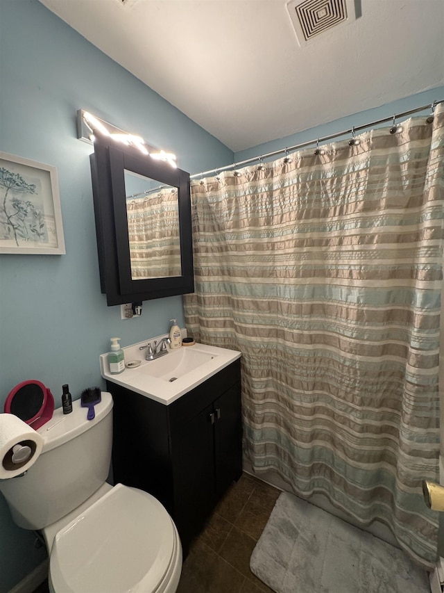 134 E Emerald St, Elkhart, IN 46514 - full bathroom featuring toilet, vanity, and tile patterned flooring