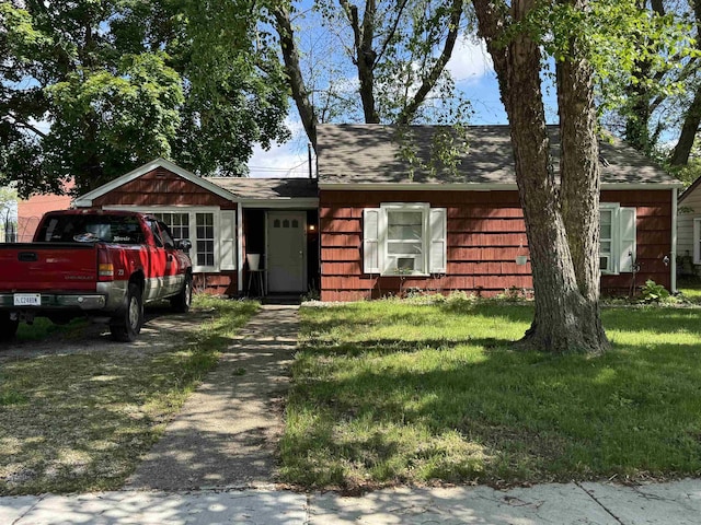 134 E Emerald St, Elkhart, IN 46514 - view of front of property with a shingled roof and a front yard