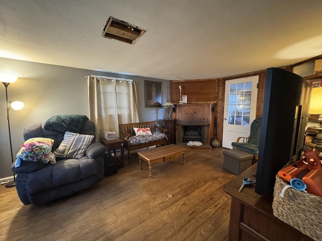 134 E Emerald St, Elkhart, IN 46514 - living room featuring hardwood / wood-style floors and a fireplace with raised hearth