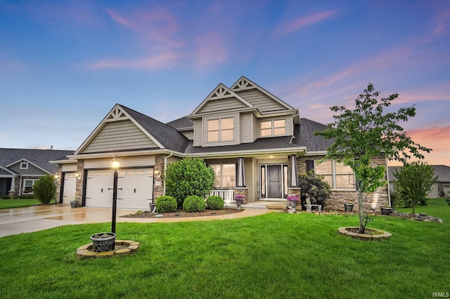 10221 Windsail Cv, New Haven, IN 46774 - craftsman inspired home featuring stone siding, a front yard, and covered porch