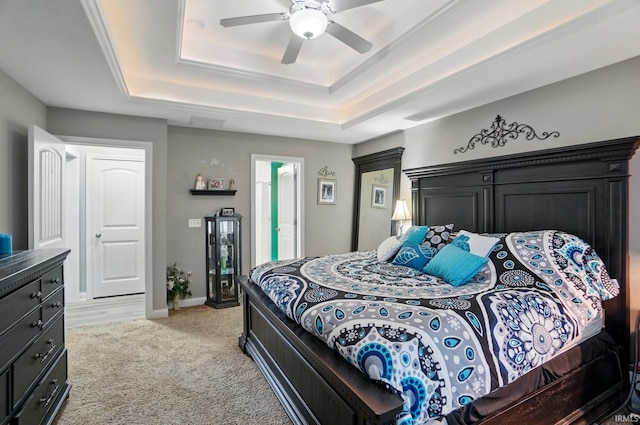 10221 Windsail Cv, New Haven, IN 46774 - bedroom featuring a tray ceiling, light carpet, a ceiling fan, and baseboards