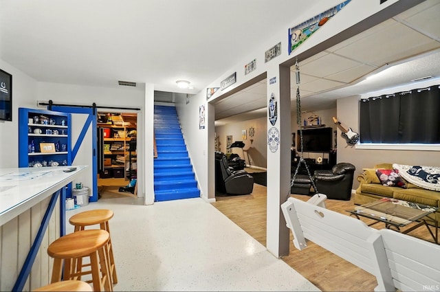 10221 Windsail Cv, New Haven, IN 46774 - living room with stairway and a barn door