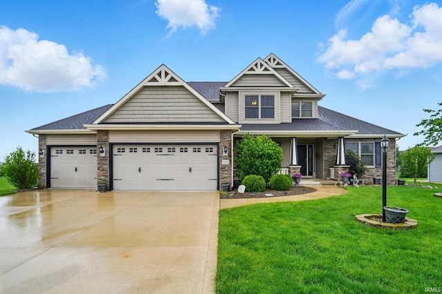 10221 Windsail Cv, New Haven, IN 46774 - craftsman inspired home with driveway, an attached garage, a front yard, stone siding, and roof with shingles