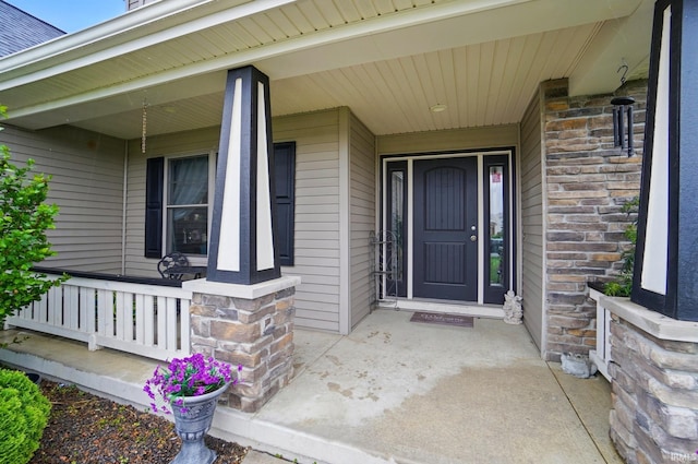 10221 Windsail Cv, New Haven, IN 46774 - entrance to property featuring a porch and stone siding