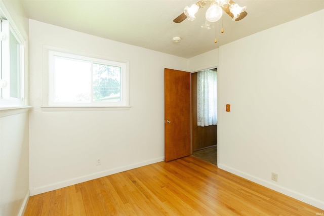 54188 Terrace Ln, South Bend, IN 46635 - spare room with light wood-style flooring, baseboards, and ceiling fan
