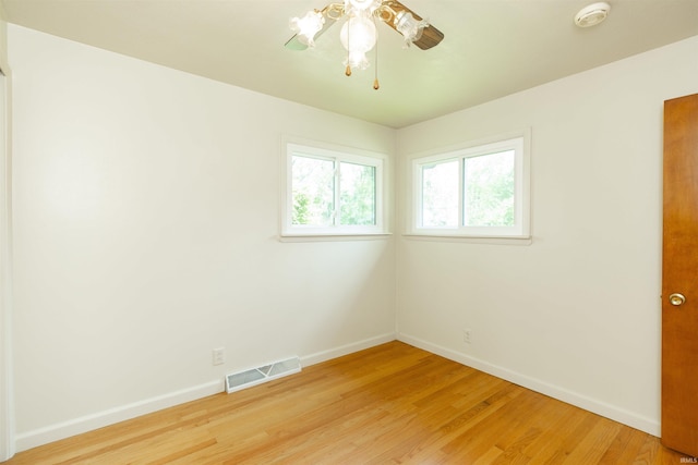 54188 Terrace Ln, South Bend, IN 46635 - unfurnished room featuring a smoke detector, baseboards, light wood-style floors, and ceiling fan