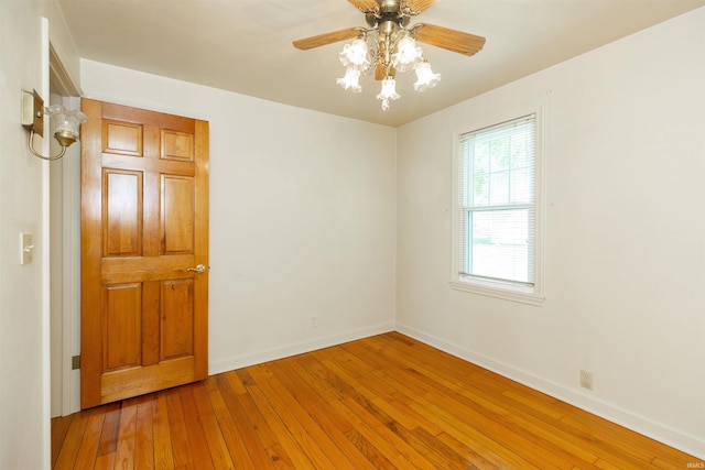 54188 Terrace Ln, South Bend, IN 46635 - unfurnished room featuring hardwood / wood-style flooring, baseboards, and a ceiling fan