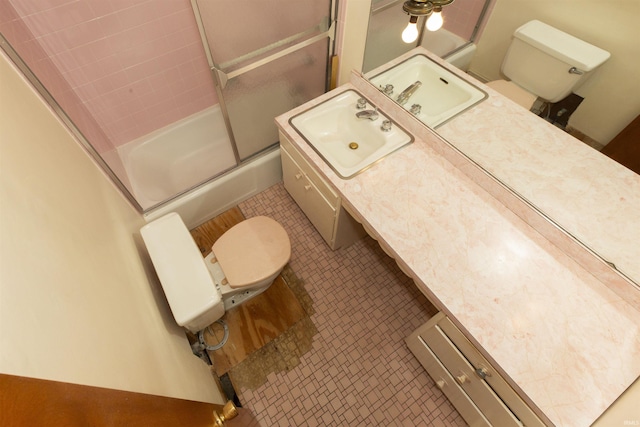 54188 Terrace Ln, South Bend, IN 46635 - bathroom with toilet, vanity, shower / bath combination with glass door, and tile patterned floors
