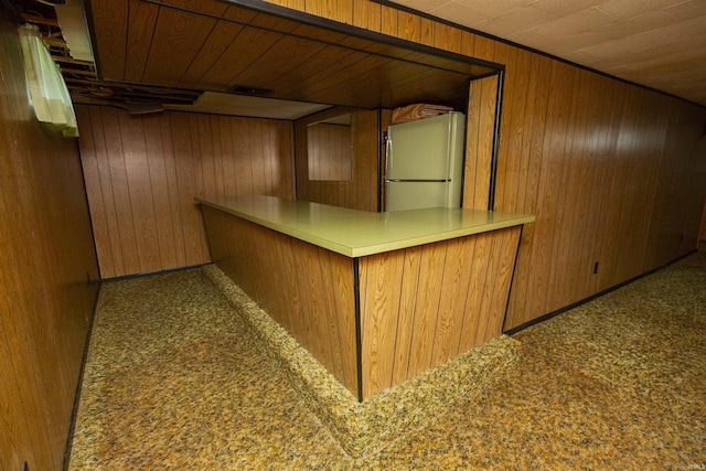 54188 Terrace Ln, South Bend, IN 46635 - indoor dry bar featuring freestanding refrigerator, wooden walls, and wood ceiling