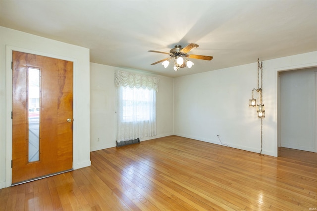 54188 Terrace Ln, South Bend, IN 46635 - unfurnished room featuring ceiling fan, light wood-style flooring, and baseboards