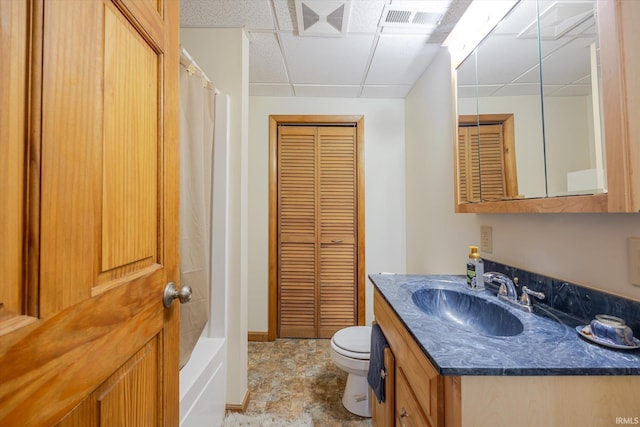5959 W Delap Rd, Ellettsville, IN 47429 - full bath with toilet, vanity, a closet, a paneled ceiling, and baseboards