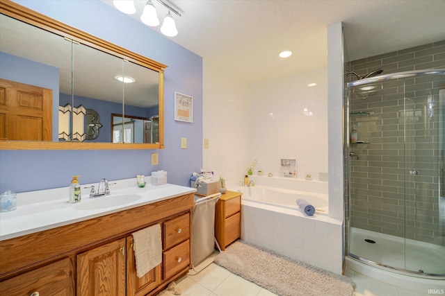 5959 W Delap Rd, Ellettsville, IN 47429 - full bathroom featuring tile patterned floors, vanity, a shower stall, and a garden tub