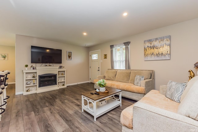 1804 W 14th St, Muncie, IN 47302 - living room with baseboards, dark wood-style flooring, recessed lighting, and a glass covered fireplace