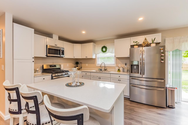 1804 W 14th St, Muncie, IN 47302 - kitchen featuring stainless steel appliances, a sink, light countertops, white cabinetry, and recessed lighting