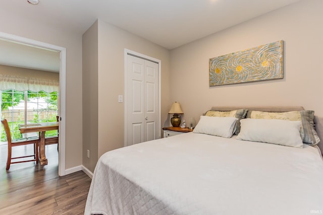 1804 W 14th St, Muncie, IN 47302 - bedroom featuring wood finished floors, baseboards, and a closet