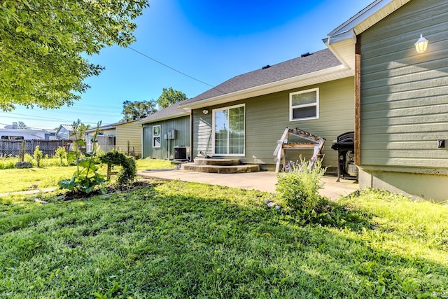 1804 W 14th St, Muncie, IN 47302 - back of house with cooling unit, a patio, and roof with shingles
