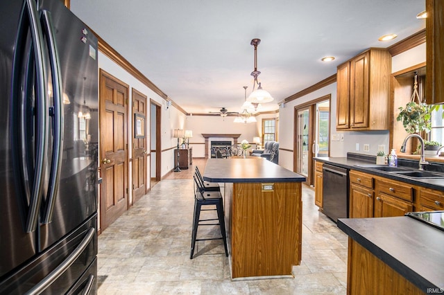 51178 Ashley Dr, Granger, IN 46530 - kitchen with freestanding refrigerator, dishwasher, dark countertops, crown molding, and a sink