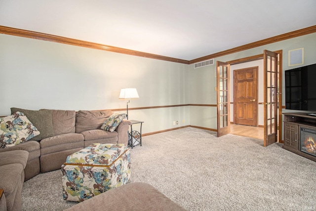 51178 Ashley Dr, Granger, IN 46530 - living area featuring french doors, crown molding, carpet flooring, baseboards, and a glass covered fireplace