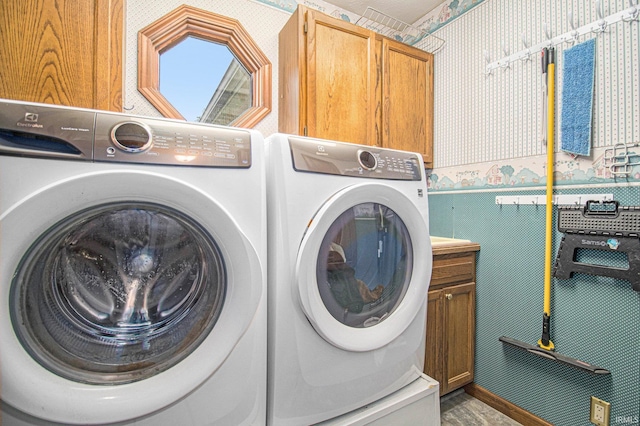 51178 Ashley Dr, Granger, IN 46530 - washroom with wallpapered walls, independent washer and dryer, cabinet space, and a wainscoted wall