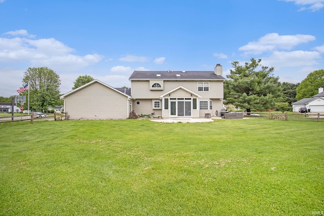 51178 Ashley Dr, Granger, IN 46530 - rear view of house with a chimney, a lawn, and a sunroom