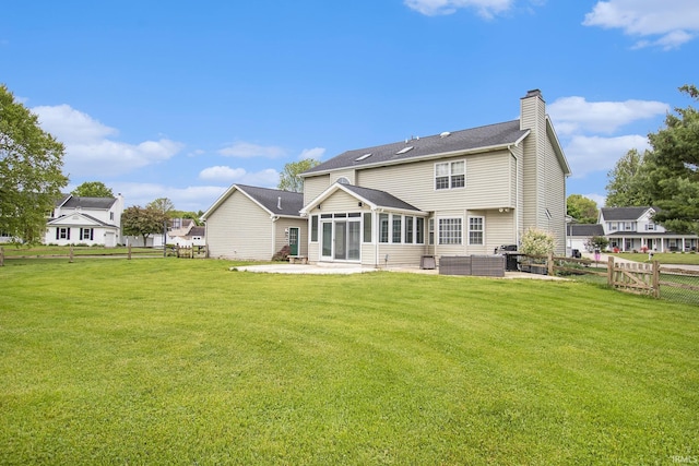 51178 Ashley Dr, Granger, IN 46530 - rear view of property featuring a patio area, a chimney, and a sunroom