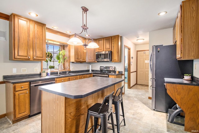 51178 Ashley Dr, Granger, IN 46530 - kitchen with stainless steel appliances, a sink, dark countertops, brown cabinets, and recessed lighting