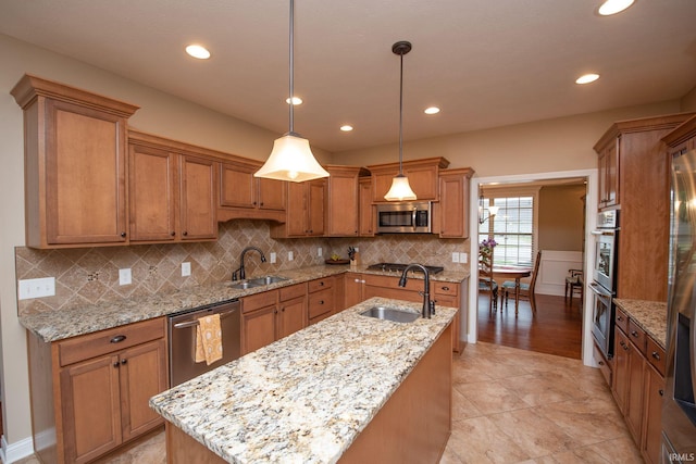 6118 Mackenzie Ct, West Lafayette, IN 47906 - kitchen with a sink, appliances with stainless steel finishes, brown cabinets, recessed lighting, and a wainscoted wall