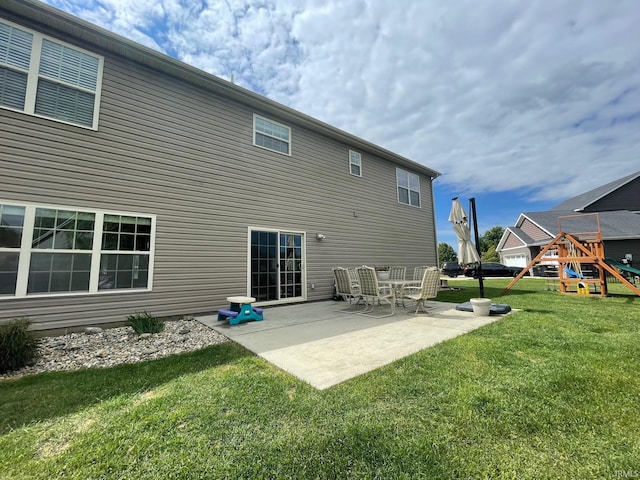 6118 Mackenzie Ct, West Lafayette, IN 47906 - back of property with a playground, a lawn, and a patio area
