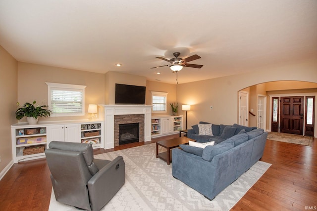 6118 Mackenzie Ct, West Lafayette, IN 47906 - living area with arched walkways, hardwood / wood-style flooring, ceiling fan, a fireplace, and recessed lighting