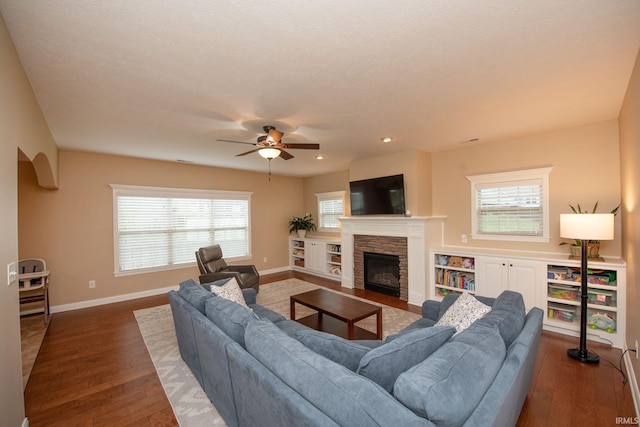 6118 Mackenzie Ct, West Lafayette, IN 47906 - living area with a ceiling fan, wood finished floors, a stone fireplace, baseboards, and recessed lighting
