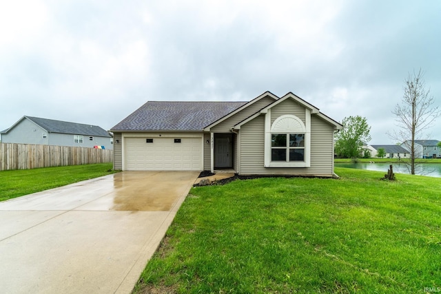 3827 Winter Raven Trl, Fort Wayne, IN 46818 - view of front of property featuring an attached garage, driveway, a water view, and roof with shingles