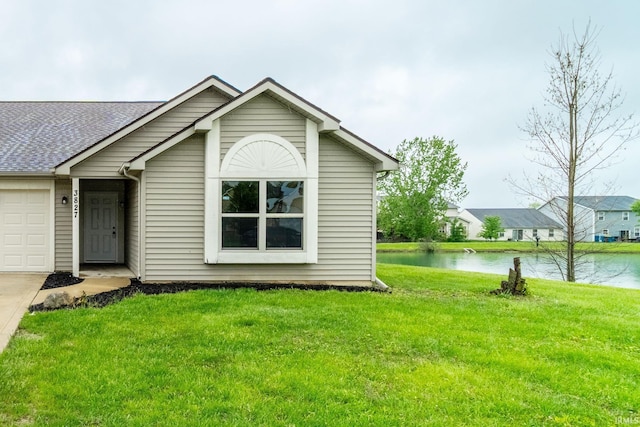 3827 Winter Raven Trl, Fort Wayne, IN 46818 - view of front facade with a water view, driveway, a garage, and a front yard