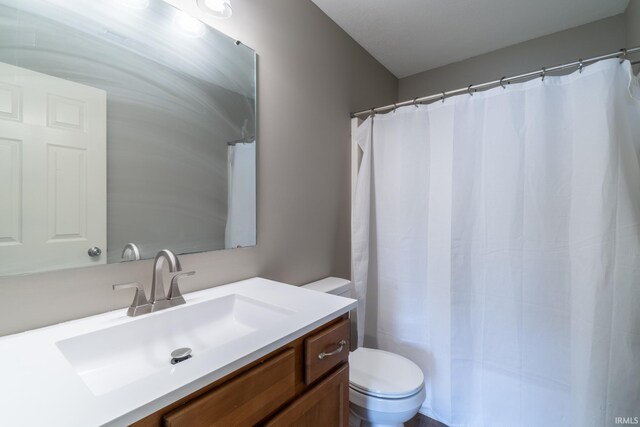 3827 Winter Raven Trl, Fort Wayne, IN 46818 - bathroom featuring toilet, vanity, and a shower with shower curtain