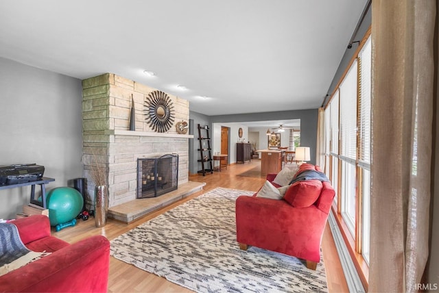 1437 W State Road 56th Rd, Jasper, IN 47546 - living room featuring a fireplace, wood finished floors, and ceiling fan