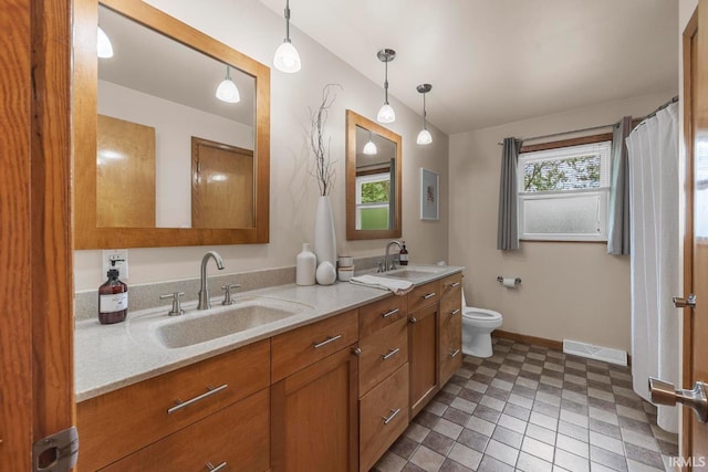 1437 W State Road 56th Rd, Jasper, IN 47546 - full bath featuring double vanity, baseboards, and toilet