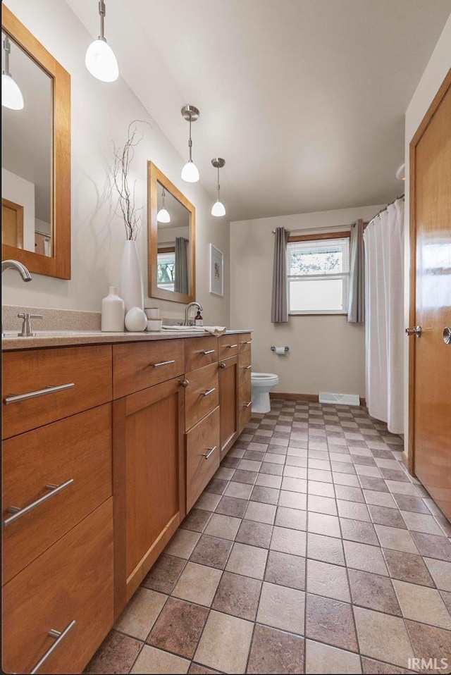 1437 W State Road 56th Rd, Jasper, IN 47546 - full bath featuring double vanity, toilet, and baseboards