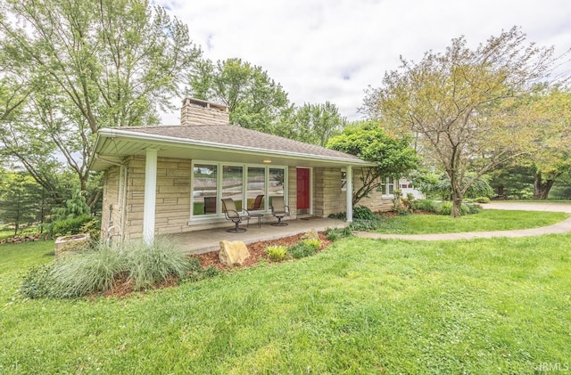 1437 W State Road 56th Rd, Jasper, IN 47546 - view of front facade featuring covered porch, stone siding, a front yard, and a chimney