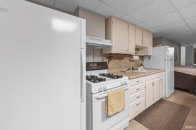 1437 W State Road 56th Rd, Jasper, IN 47546 - kitchen with white appliances, under cabinet range hood, a drop ceiling, tasteful backsplash, and light countertops