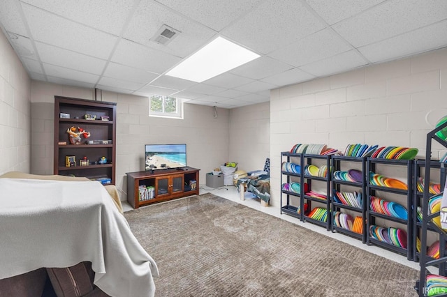 1437 W State Road 56th Rd, Jasper, IN 47546 - rec room with concrete block wall, a drop ceiling, and carpet