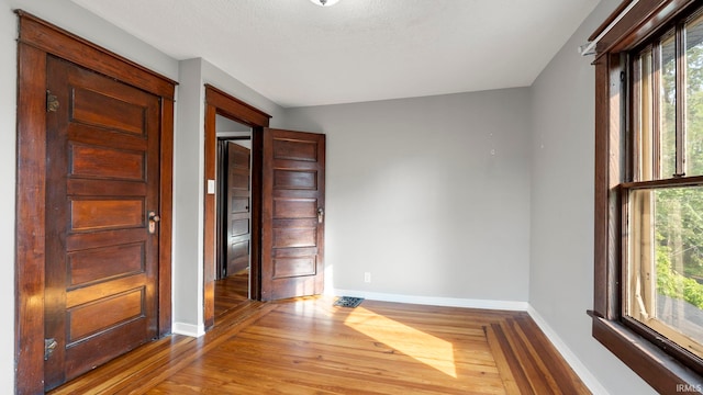 524 Byron St, Huntington, IN 46750 - unfurnished room with baseboards and wood finished floors