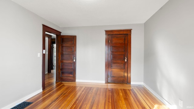 524 Byron St, Huntington, IN 46750 - spare room with hardwood / wood-style floors and baseboards