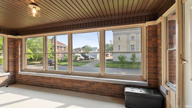 524 Byron St, Huntington, IN 46750 - unfurnished sunroom with brick wall and wooden ceiling